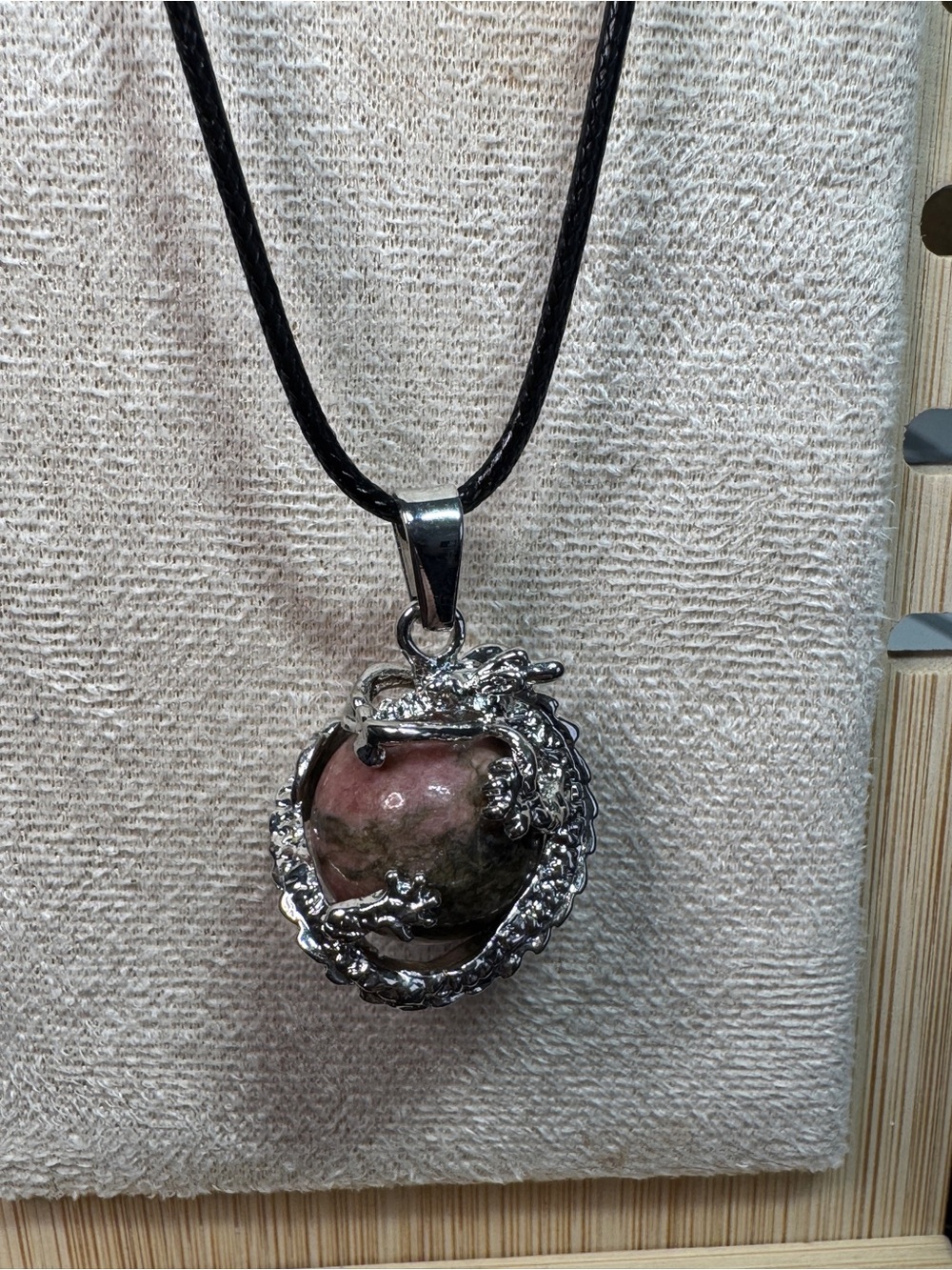 Silver Dragon Orb Pendant Necklace surrounding Rhodenite Stone